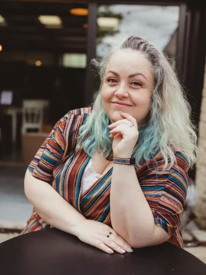 Carolyn smiling to camera